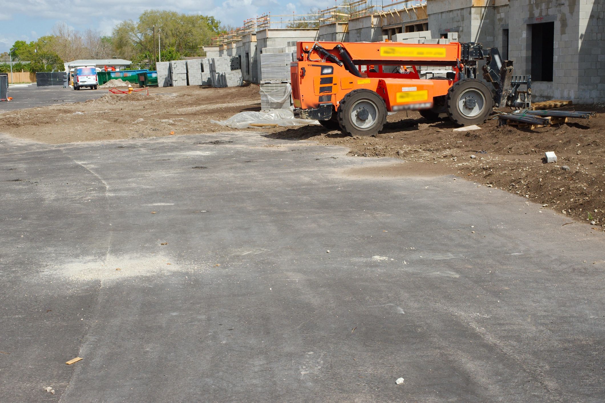 Construction site showing graded access area and surface preparation
