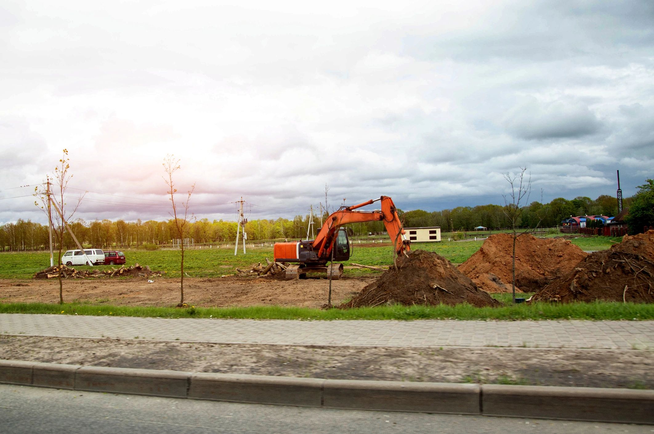 Excavator working on driveway repair earthwork